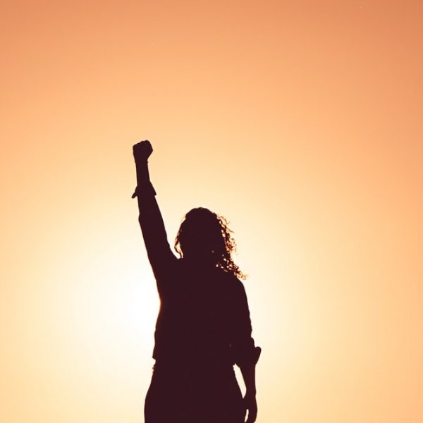 Woman holding fist to the sky