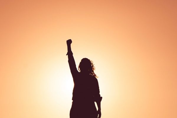 Woman holding fist to the sky